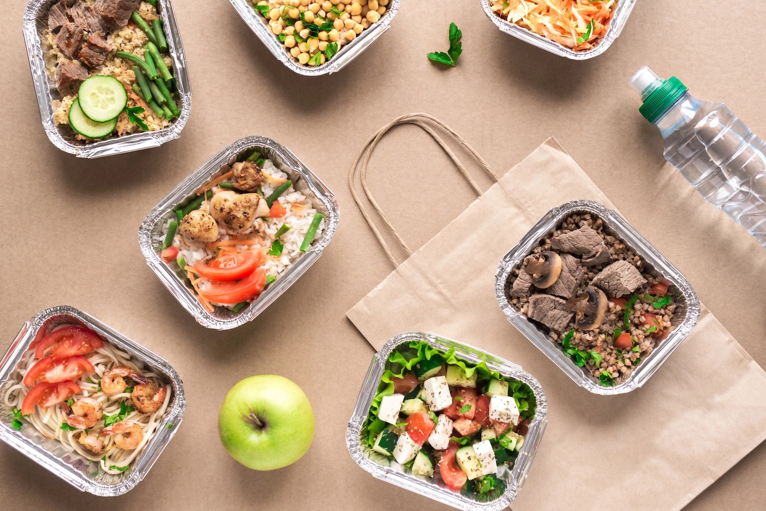 An assortment of freshly prepared GA Foods meals in containers, ready for delivery